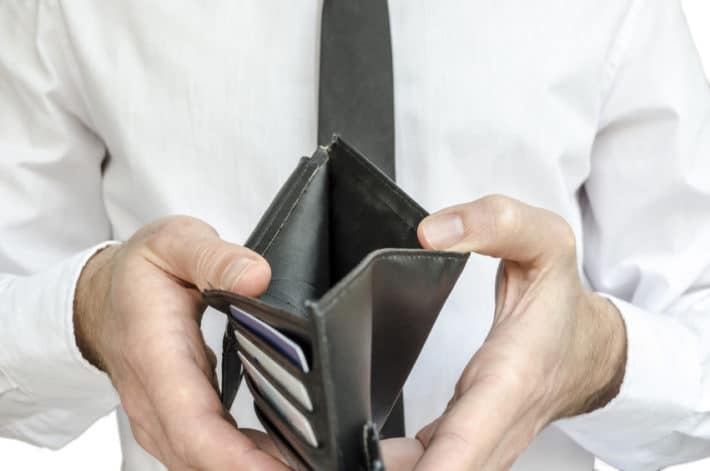 Man holding an empty wallet